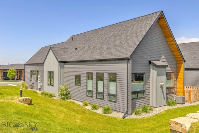 142 Albrey Trl Unit C, Bozeman, MT 59718 - rear view of property featuring a yard and roof with shingles