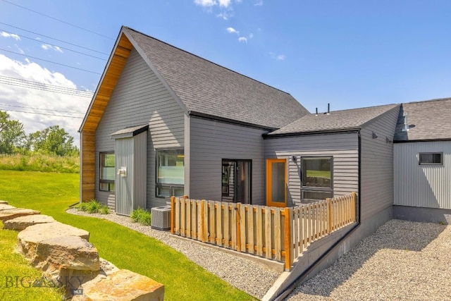142 Albrey Trl Unit C, Bozeman, MT 59718 - rear view of property featuring roof with shingles and a lawn
