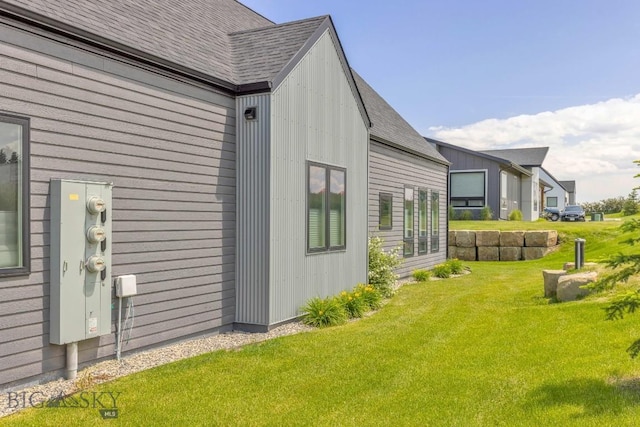 142 Albrey Trl Unit C, Bozeman, MT 59718 - view of home's exterior featuring roof with shingles and a lawn