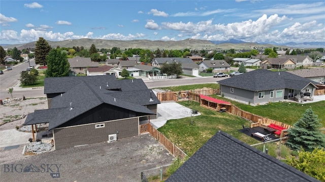 701 Barnett St, Dillon, MT 59725 - aerial view of residential area with a mountainous background