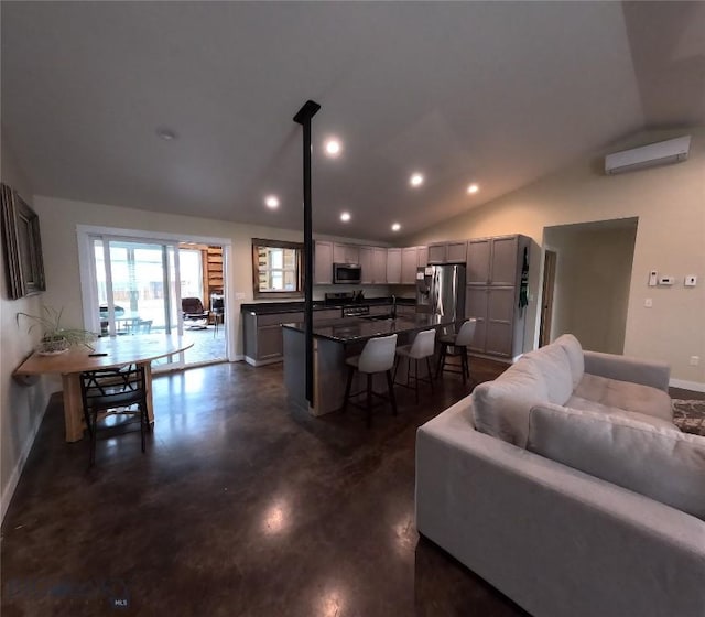 701 Barnett St, Dillon, MT 59725 - living room with lofted ceiling, concrete floors, and recessed lighting