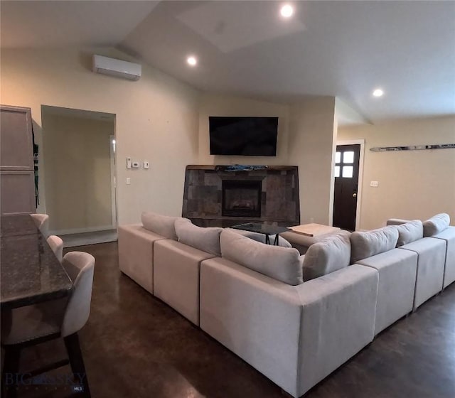 701 Barnett St, Dillon, MT 59725 - living room with finished concrete floors, a wall mounted AC, a fireplace, lofted ceiling, and recessed lighting