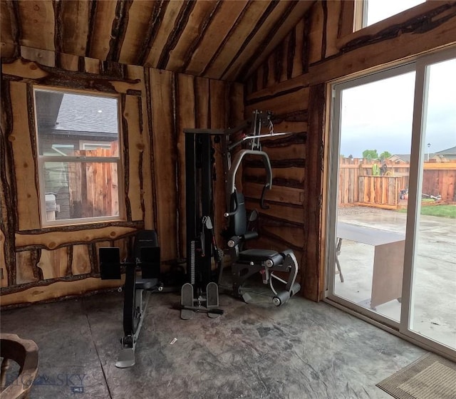 701 Barnett St, Dillon, MT 59725 - exercise area featuring lofted ceiling and wooden walls