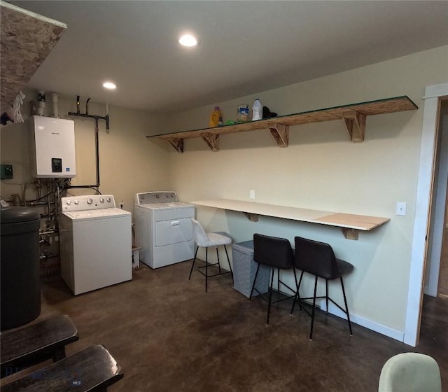701 Barnett St, Dillon, MT 59725 - laundry area featuring washer and clothes dryer, tankless water heater, and recessed lighting