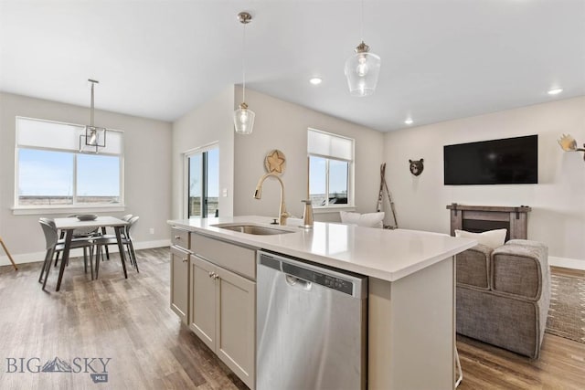 5197 Samantha Ln Unit B, Bozeman, MT 59718 - kitchen featuring dishwasher, wood finished floors, light countertops, open floor plan, and hanging light fixtures