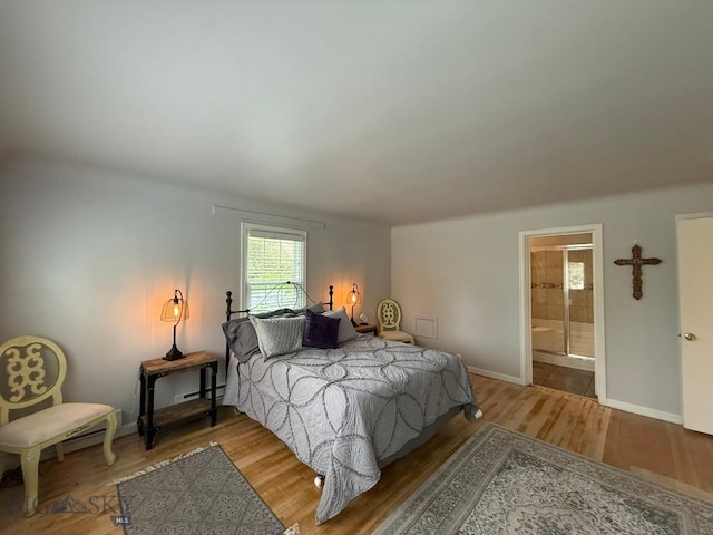 2821 Edwards, Butte, MT 59701 - bedroom featuring light wood-style flooring and ensuite bath