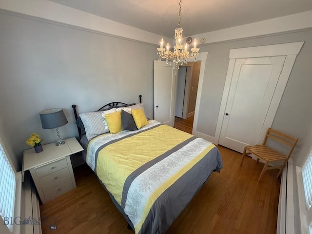 2821 Edwards, Butte, MT 59701 - bedroom featuring a chandelier, wood finished floors, and a closet