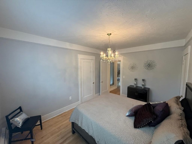 2821 Edwards, Butte, MT 59701 - bedroom with a chandelier and light wood finished floors