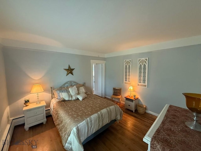 2821 Edwards, Butte, MT 59701 - bedroom featuring wood finished floors and a baseboard radiator