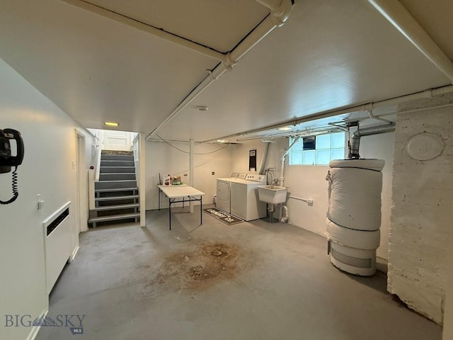 2821 Edwards, Butte, MT 59701 - below grade area featuring washing machine and clothes dryer, water heater, and stairway
