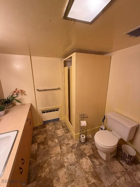 2821 Edwards, Butte, MT 59701 - bathroom with a stall shower, vanity, and stone finish floors