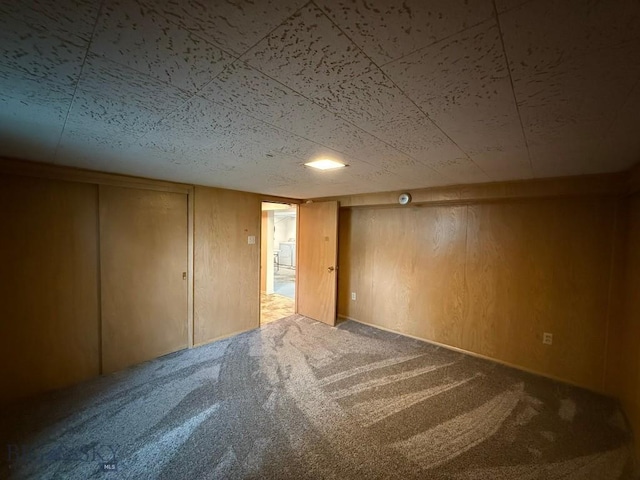 2821 Edwards, Butte, MT 59701 - carpeted empty room with wooden walls