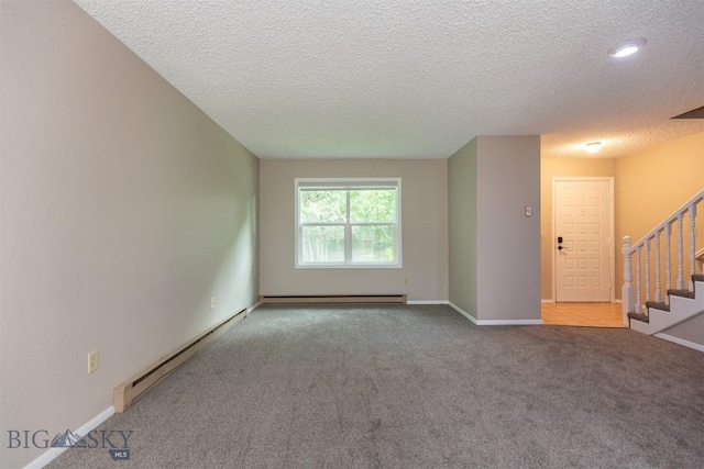12 E Garfield St Unit D4, Bozeman, MT 59715 - unfurnished living room featuring a baseboard radiator, a textured ceiling, stairway, carpet, and baseboard heating