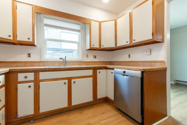 12 E Garfield St Unit D4, Bozeman, MT 59715 - kitchen with stainless steel dishwasher, light wood-type flooring, light countertops, and white cabinets