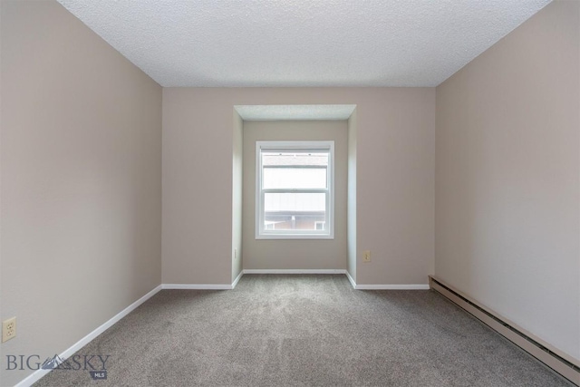 12 E Garfield St Unit D4, Bozeman, MT 59715 - unfurnished room featuring baseboard heating, carpet floors, and a textured ceiling