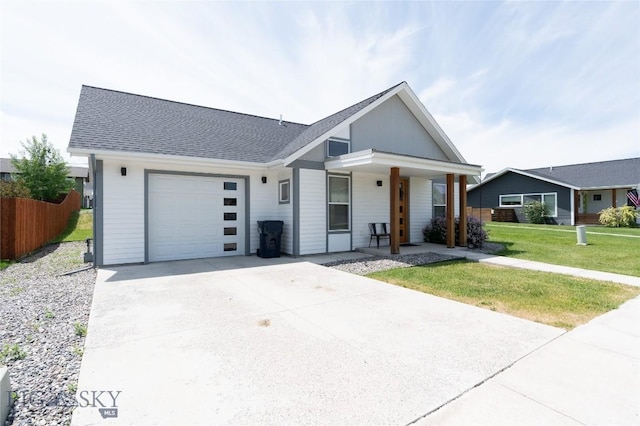 4454 Shadow Gln, Bozeman, MT 59718 - view of front of property with a garage, covered porch, concrete driveway, and roof with shingles