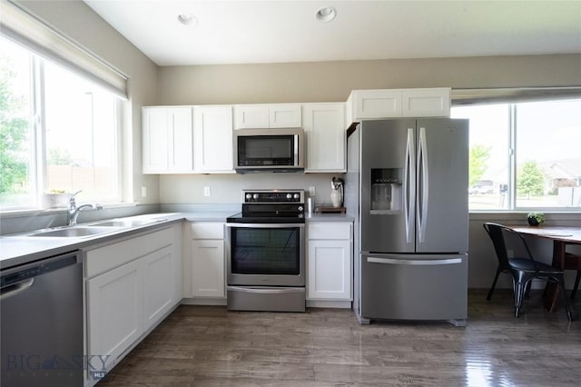 4454 Shadow Gln, Bozeman, MT 59718 - kitchen featuring stainless steel appliances, white cabinets, recessed lighting, and light countertops