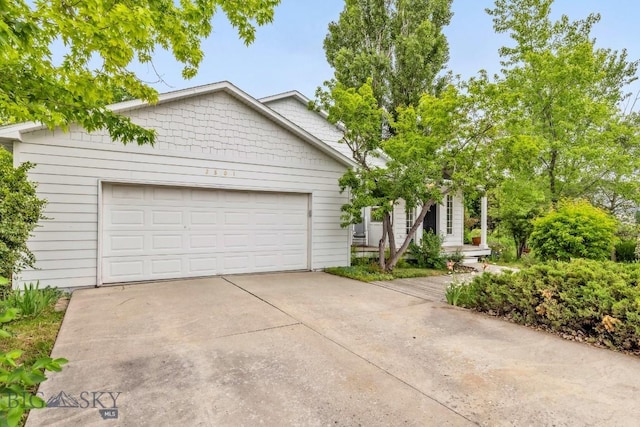 2801 W Villard St, Bozeman, MT 59718 - view of front of property with driveway and a garage