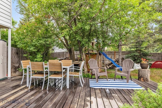 2801 W Villard St, Bozeman, MT 59718 - wooden deck featuring a fenced backyard and outdoor dining space