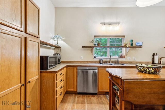 2801 W Villard St, Bozeman, MT 59718 - kitchen with stainless steel appliances, open shelves, light countertops, light wood-style floors, and brown cabinetry