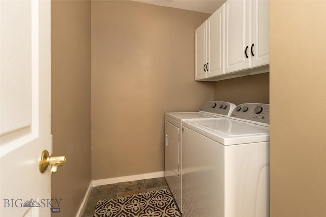 456 Firelight, Big Sky, MT 59716 - laundry room featuring separate washer and dryer, cabinet space, and dark tile patterned flooring
