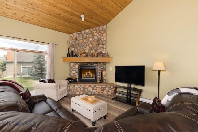 456 Firelight, Big Sky, MT 59716 - living area featuring wood finished floors, vaulted ceiling, a fireplace, and wooden ceiling