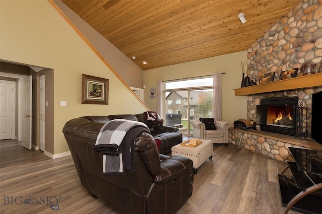 456 Firelight, Big Sky, MT 59716 - living room featuring wooden ceiling, high vaulted ceiling, a fireplace, and wood finished floors