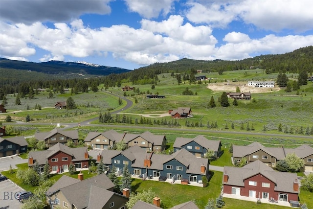456 Firelight, Big Sky, MT 59716 - aerial perspective of suburban area featuring mountains and a forest