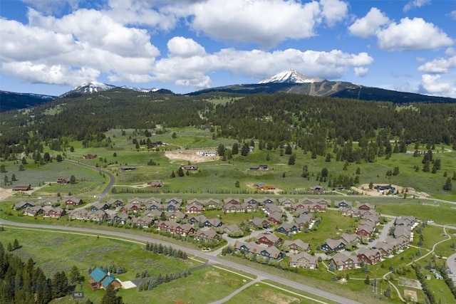 456 Firelight, Big Sky, MT 59716 - aerial view of residential area with a mountain backdrop and a forest