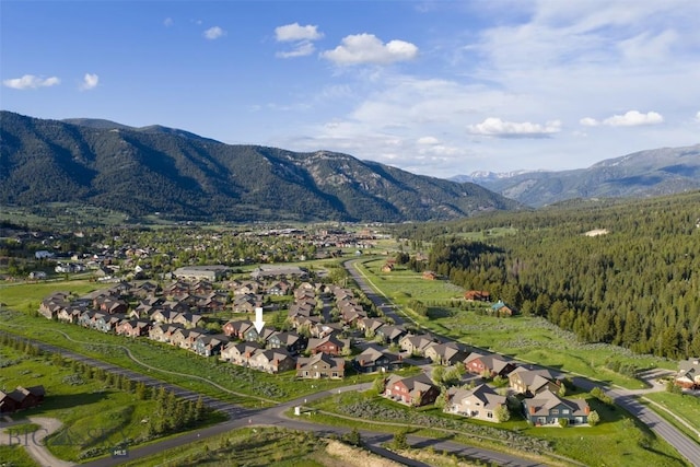 456 Firelight, Big Sky, MT 59716 - aerial overview of property's location featuring a mountain backdrop and nearby suburban area