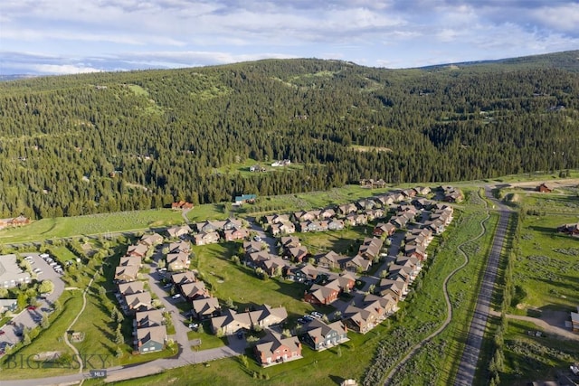 456 Firelight, Big Sky, MT 59716 - aerial view of property and surrounding area with a forest
