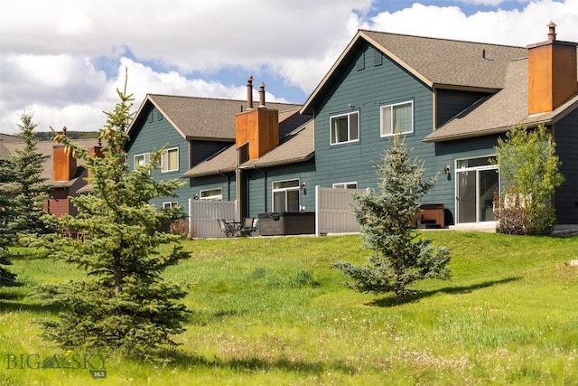 456 Firelight, Big Sky, MT 59716 - rear view of property with roof with shingles and a chimney