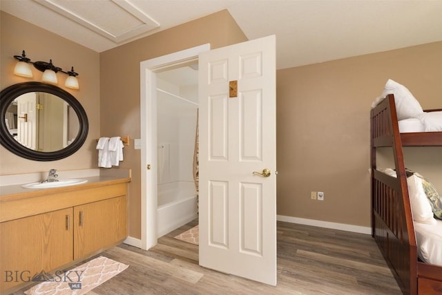 456 Firelight, Big Sky, MT 59716 - full bathroom with wood finished floors, vanity, and tub / shower combination