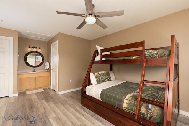 456 Firelight, Big Sky, MT 59716 - bedroom with light wood-style floors, attic access, and a ceiling fan