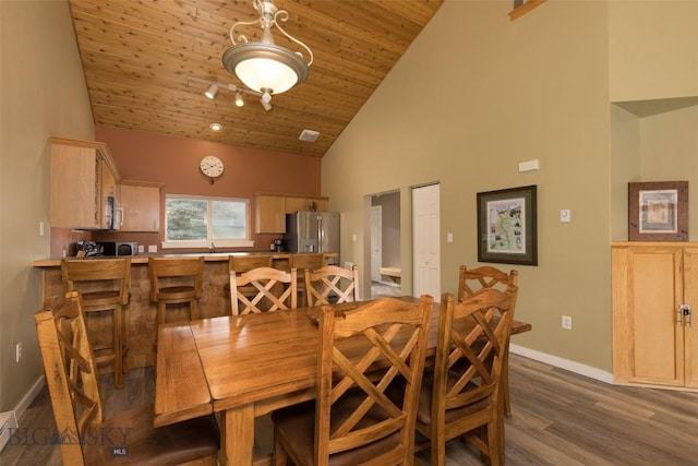 456 Firelight, Big Sky, MT 59716 - dining space featuring high vaulted ceiling, dark wood-style floors, and wood ceiling