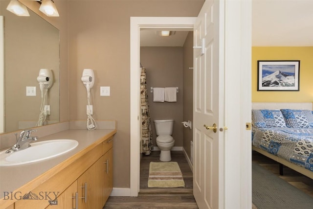 456 Firelight, Big Sky, MT 59716 - full bath with vanity, wood finished floors, and ensuite bathroom
