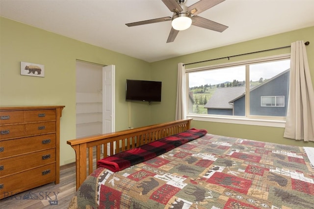 456 Firelight, Big Sky, MT 59716 - bedroom featuring wood finished floors and a ceiling fan