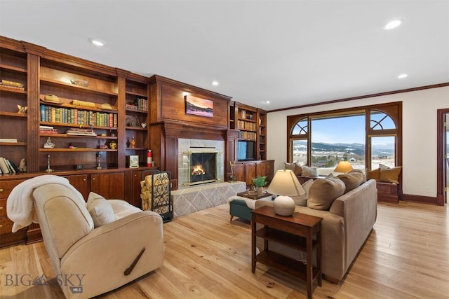 10423 Bridger Canyon Rd, Bozeman, MT 59715 - living room with ornamental molding, a premium fireplace, light wood-style flooring, and recessed lighting