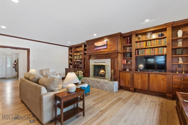 10423 Bridger Canyon Rd, Bozeman, MT 59715 - living room with light wood-style flooring, crown molding, a fireplace, and recessed lighting