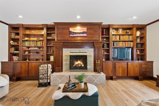 10423 Bridger Canyon Rd, Bozeman, MT 59715 - living room with light wood-style floors, a tile fireplace, recessed lighting, and crown molding