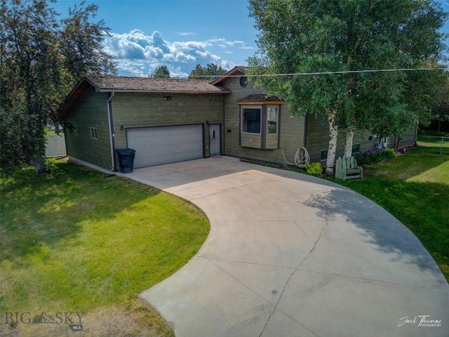 620 Higgins, Deer Lodge, MT 59722 - split level home with a front lawn, an attached garage, and driveway