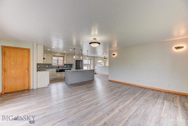 620 Higgins, Deer Lodge, MT 59722 - unfurnished living room featuring light wood-style floors and baseboards