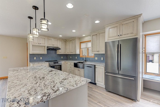 620 Higgins, Deer Lodge, MT 59722 - kitchen with stainless steel appliances, cream cabinetry, light wood-style flooring, and recessed lighting