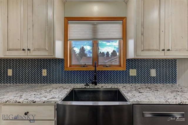 620 Higgins, Deer Lodge, MT 59722 - kitchen featuring tasteful backsplash, dishwasher, and light stone counters