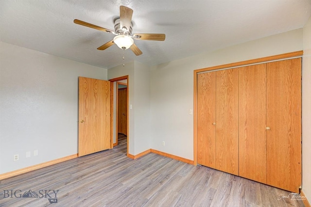 620 Higgins, Deer Lodge, MT 59722 - unfurnished bedroom featuring wood finished floors, a closet, and ceiling fan