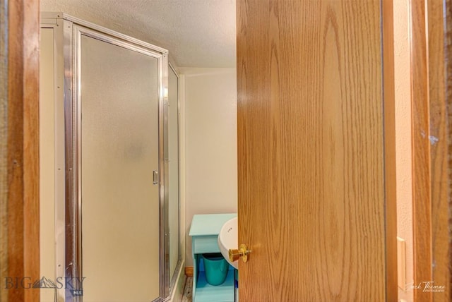 620 Higgins, Deer Lodge, MT 59722 - full bathroom with a shower stall and a textured ceiling