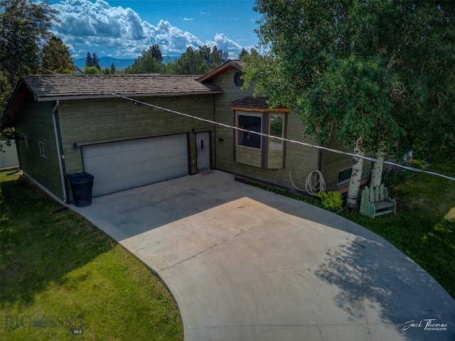 620 Higgins, Deer Lodge, MT 59722 - view of front of house with an attached garage, a front yard, and driveway