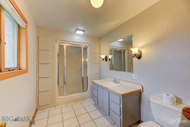 620 Higgins, Deer Lodge, MT 59722 - full bathroom with a shower stall, vanity, tile patterned flooring, and a textured ceiling