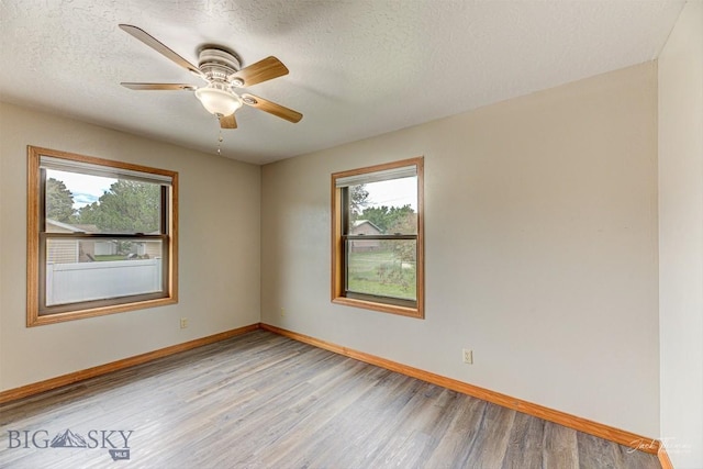 620 Higgins, Deer Lodge, MT 59722 - unfurnished room featuring healthy amount of natural light, light wood-type flooring, a ceiling fan, and a textured ceiling