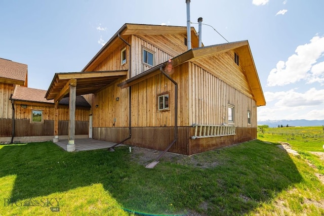 241 Aspen Loop Rd, West Yellowstone, MT 59758 - rear view of property with a yard and a patio